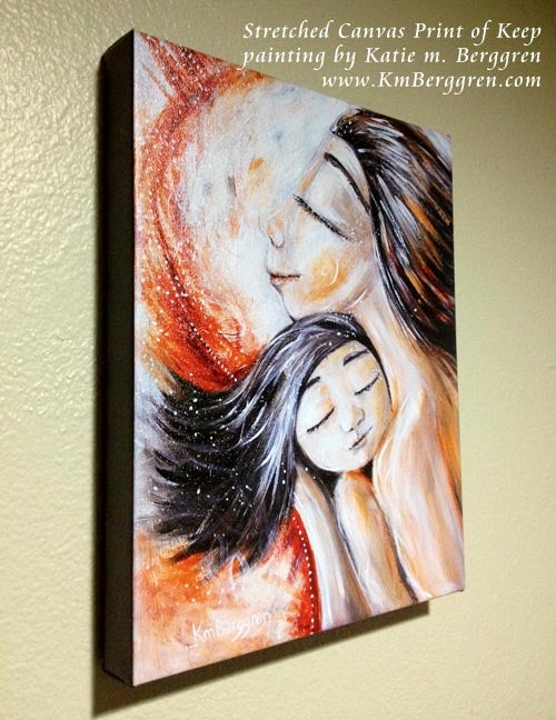 stretched canvas art print of Asian mother holding daughter against her chest by KmBerggren