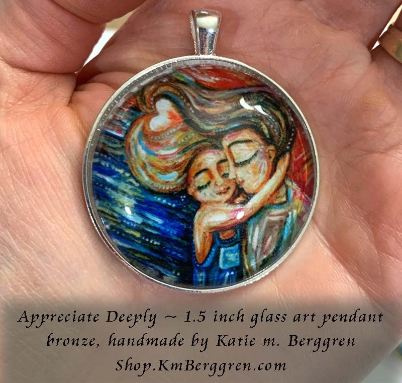 silver and bronze glass art pendant 1.5 inches across handmade by the artist