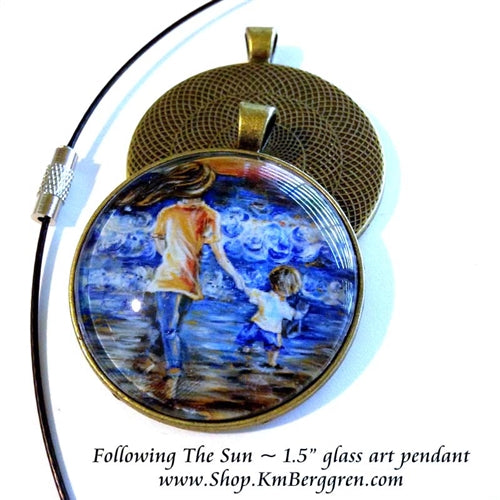 mother and child walking on the beach glass art pendant 1.5 inches across handmade by the artist