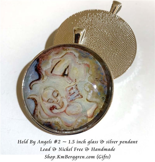 1.5 inch glass art pendant of woman holding angel baby, handmade by artist KmBerggren
