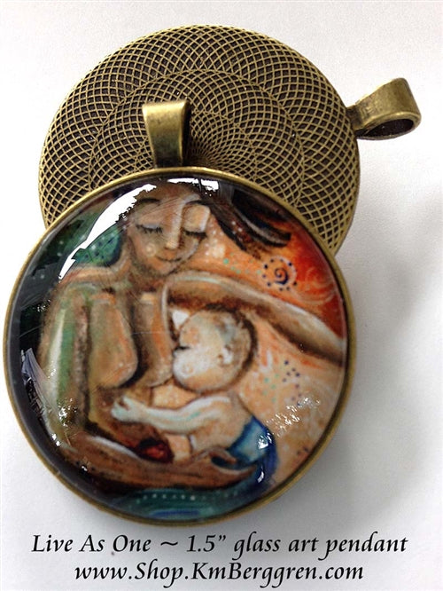 glass art pendant of biracial mother nursing lighter skin baby 1.5 inches across handmade by the artist