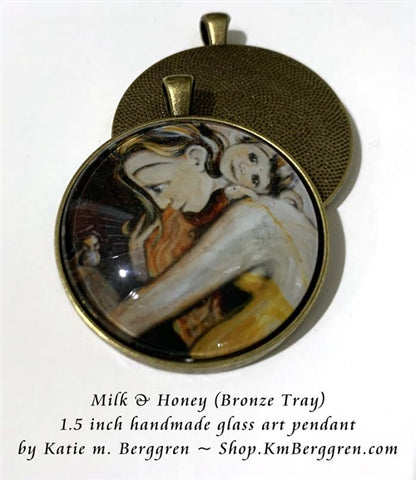 glass art pendant necklace of happy mommy with little girl and bird 1.5 inches across handmade by the artist