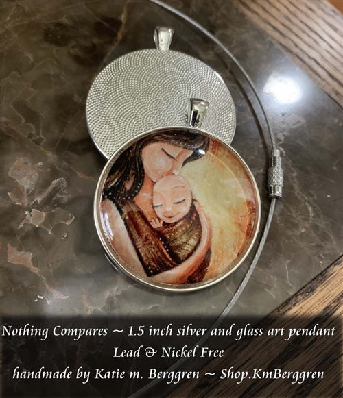 glass art babywearing pendant necklace of mother and child 1.5 inches across handmade by the artist