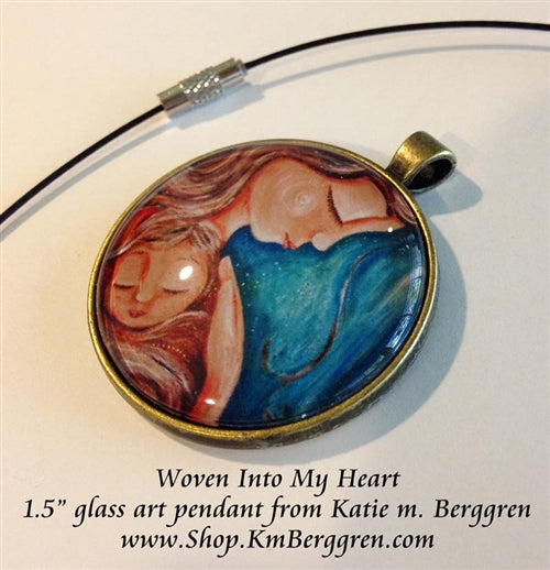 mother holding child close glass art pendant necklace mothers gift 1.5 inches across handmade by the artist