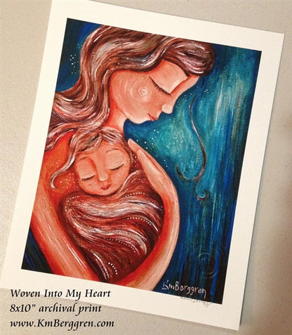 art print of a mother wearing her child in her heart in reds and blues by KmBerggren